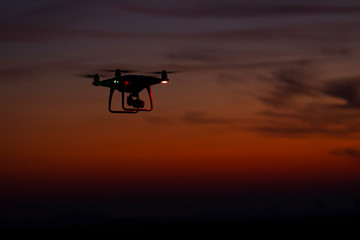 Fototapeta na wymiar Drone in flight at sunset