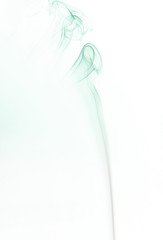 Abstract cloud of aqua menthe color smoke swirling on white background