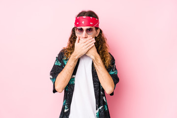 Young hippie caucasian man isolated shocked covering mouth with hands.