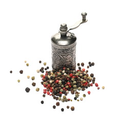 Retro silver pepper mill, with colorful mixed peppercorns isolated on white