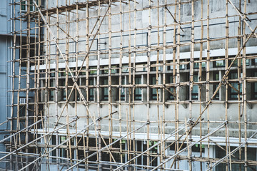 Bamboo pole scaffolding on building construction site