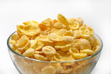 Cornflakes in a glass plate close-up. Healthy breakfast.