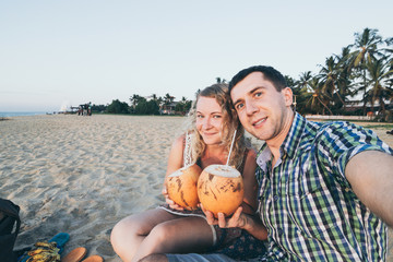 Couple taking selfie at tropical beach in Sri Lanka