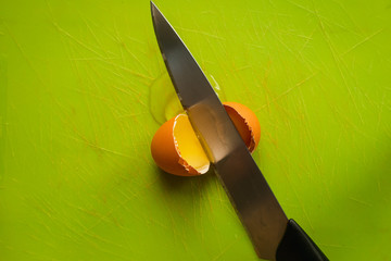 high angle view of egg yolk on a green background