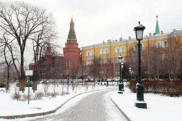 Moscow Kremlin during snow, russian winter landscape in winter. View to the Alexander garden, cold weather in Russia