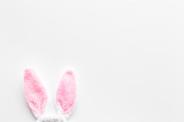 Easter concept. Bunny's ears on whie background top-down copy space