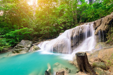 Fototapeta na wymiar Waterfall in Tropical forest at Erawan waterfall National Park, Thailand 