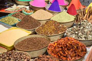 Different spicy and color powder for sell on street market in Gokarna. India