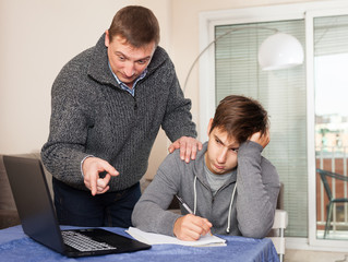 Father scolds his son for bad schooling
