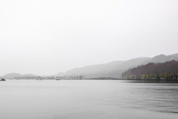 mist at grey lake in winter 
