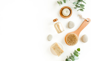 Spa concept with eucalyptus oil and eucalyptus leaf extract natural /organic spa cosmetics products, eco friendly bathroom accessories. Skincare concept on white background. Flat lay composition 