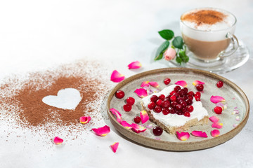Heart shaped cappuccino and cheese sandwich with red berries.The idea for a festive breakfast, Valentine's Day.