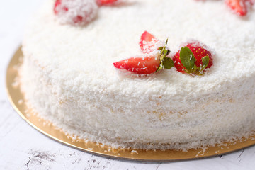 Homemade delicious sweet strawberry cake with red berries on cup of coffee americano, white background. Organic dessert sugarless. Healthy eating.