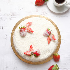 Homemade delicious sweet strawberry cake with red berries on cup of coffee americano, white background. Organic dessert sugarless. Healthy eating.