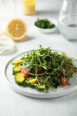 Arugula salad with grapefruit and avocado
