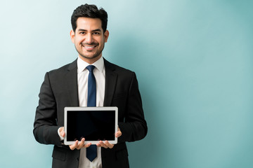 Hispanic Male Entrepreneur Showing Wireless Technology