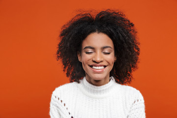 Obraz premium Beautiful young african woman wearing sweater