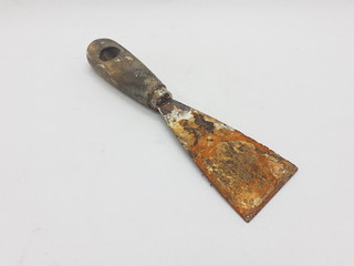Handheld Vintage Old Used Dirty Rusty Scraper for Wall Builder Maintenance Tools in White isolated...