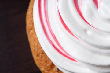 Vanilla cupcake, with a protein cream in the form, stained with red currant juice.