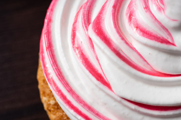 Vanilla cupcake, with a protein cream in the form, stained with red currant juice.