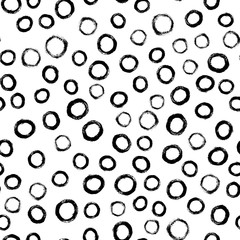 Seamless polka dot pattern hand drawn with a brush. Vector Monochrome Grunge texture of circles. Scandinavian background