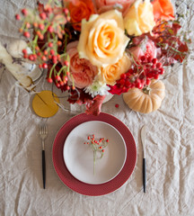 Fototapeta na wymiar Empty plate with flowers on table