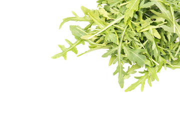 Arugula leaves on a heap isolated on a white background