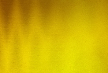 Obraz premium Shiny yellow leaf gold foil texture background.