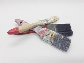 Used Vintage Rusty Dirty Colorful Paint Brush for Builder Tools in White Isolated Background
