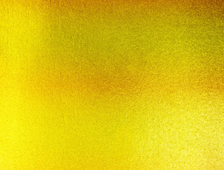 abstract background. shiny yellow of gold foil texture