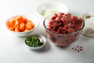 Raw beef with vegetables ready for cooking