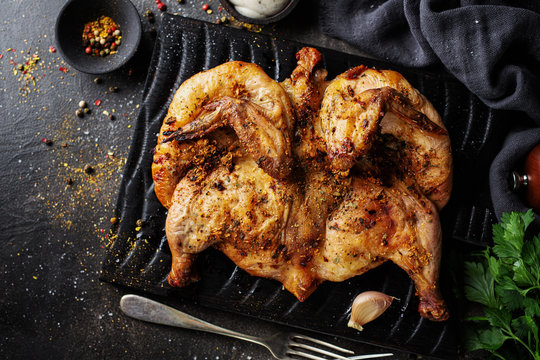 Baked chicken tabaka with spices