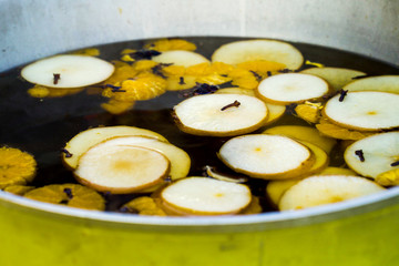 Mulled cider with fruit and spices on Christmas market