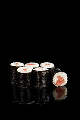 delicious sushi maki with tuna isolated on black