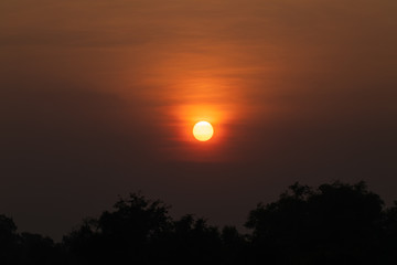 Sunset orange sky background at evening with clouds