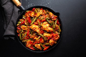Stuffed meat with vegetables on pan
