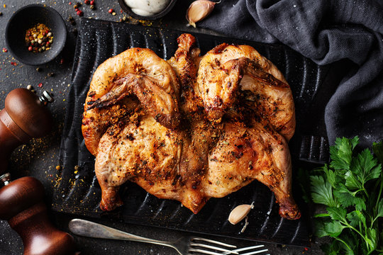Baked chicken tabaka with spices