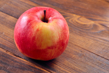 red apple on wooden background