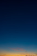 Colorful clear sky with no clouds at dusk after sunset.