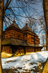 Fototapeta premium Exterior of Smolnik Wooden Orthodox Church. Bieszczady Architecture in Winter. Carpathia Region in Poland