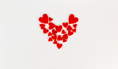 Red heart shapes on white background for Valentine's Day.
