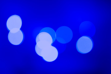 blurry lights holiday decoration neutral background blue colors