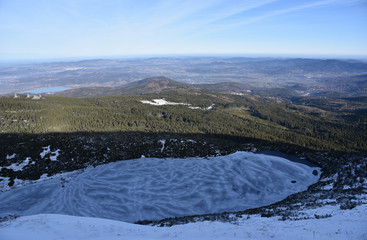 Winter panorama of mountain lake and Karkonosze mountains in National Park - Lower Silesia region, Poland.