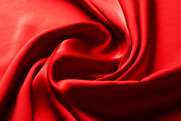 Red ruby color silk fabric background, top view