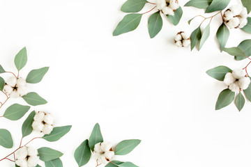 Leaves eucalyptus and cotton frame borders on white background with empty space for text. Flat lay,...