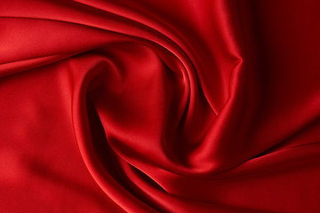 Red ruby color silk fabric background, top view