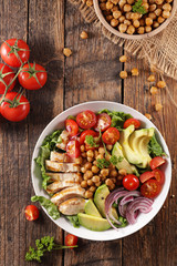 buddhal bowl, vegetable salad with grilled chicken, avocado, tomato and chickpea