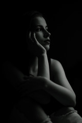 Obraz na płótnie Canvas Studio portrait of a beautiful brunette on a black background