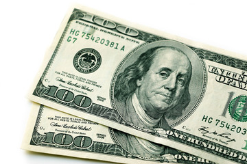 One hundred dollars. Money. Paper bills in denominations of one hundred dollars. Business and Finance.