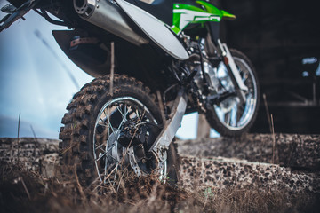 Action the wheel of an Enduro Motorcycle Hits an obstacle in the ground